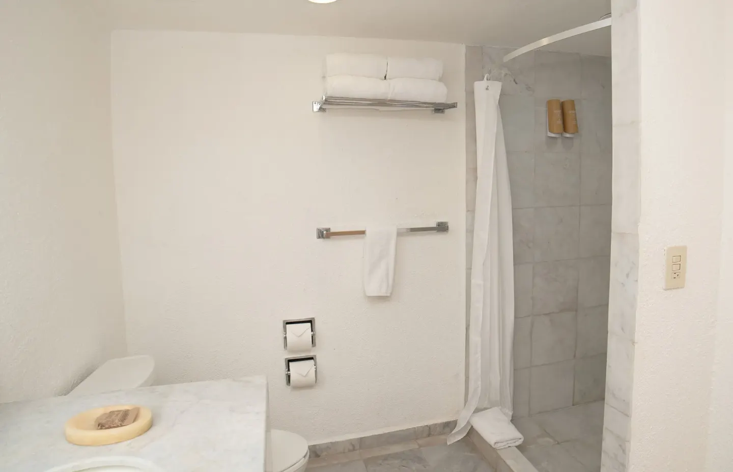 Standard Room bathroom with walk-in shower and towels at Samba Vallarta.