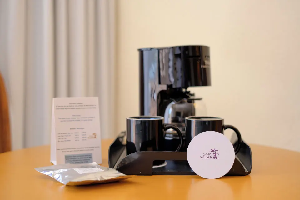 Standard Room coffee maker with mugs and supplies at Samba Vallarta.
