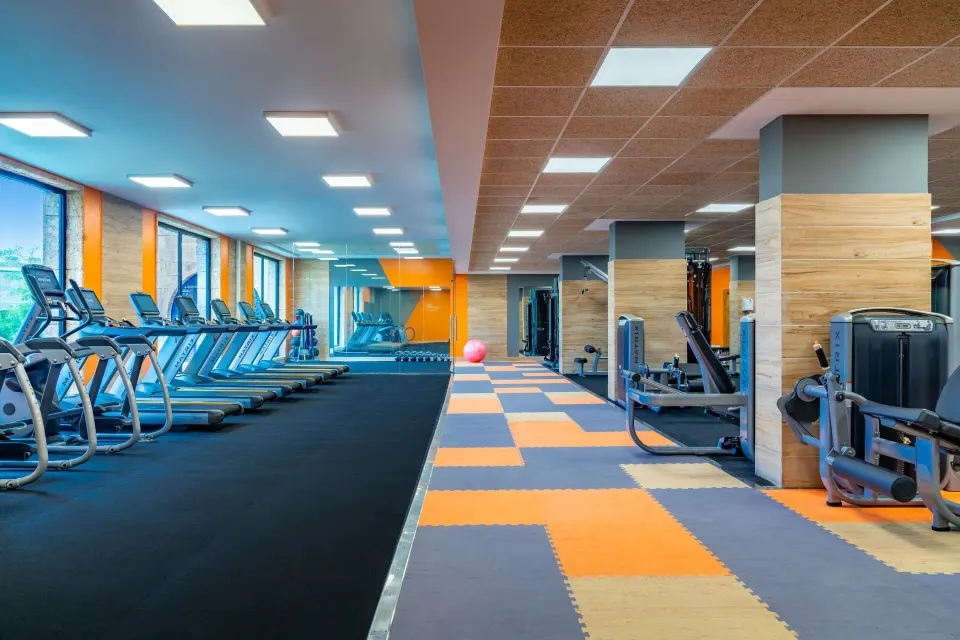 Spacious fitness center with treadmills and strength machines at Sanctuary Cap Cana, a Luxury Collection Resort.