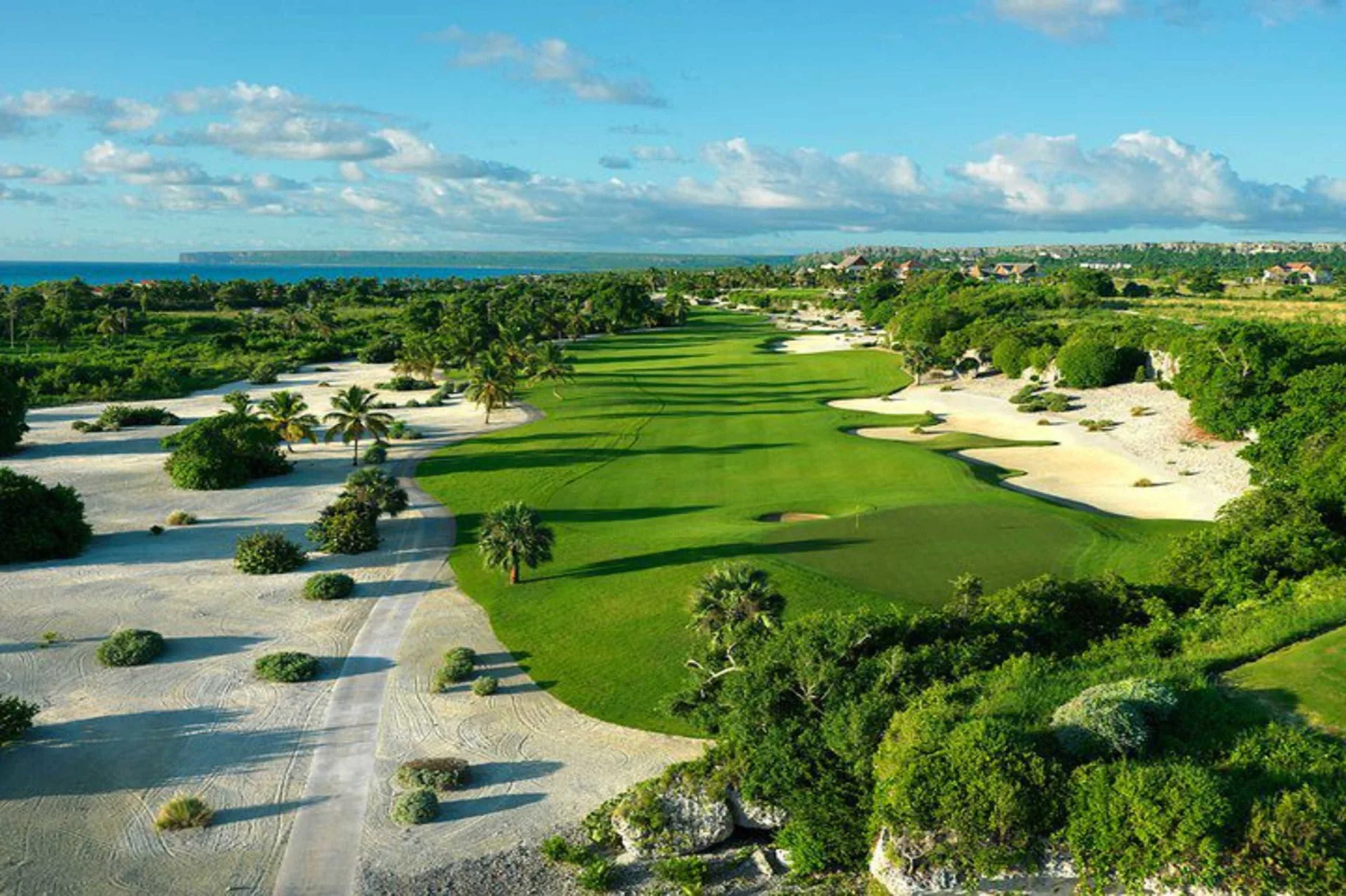 Wide golf fairway with white sand areas near Sanctuary Cap Cana, a Luxury Collection Resort.