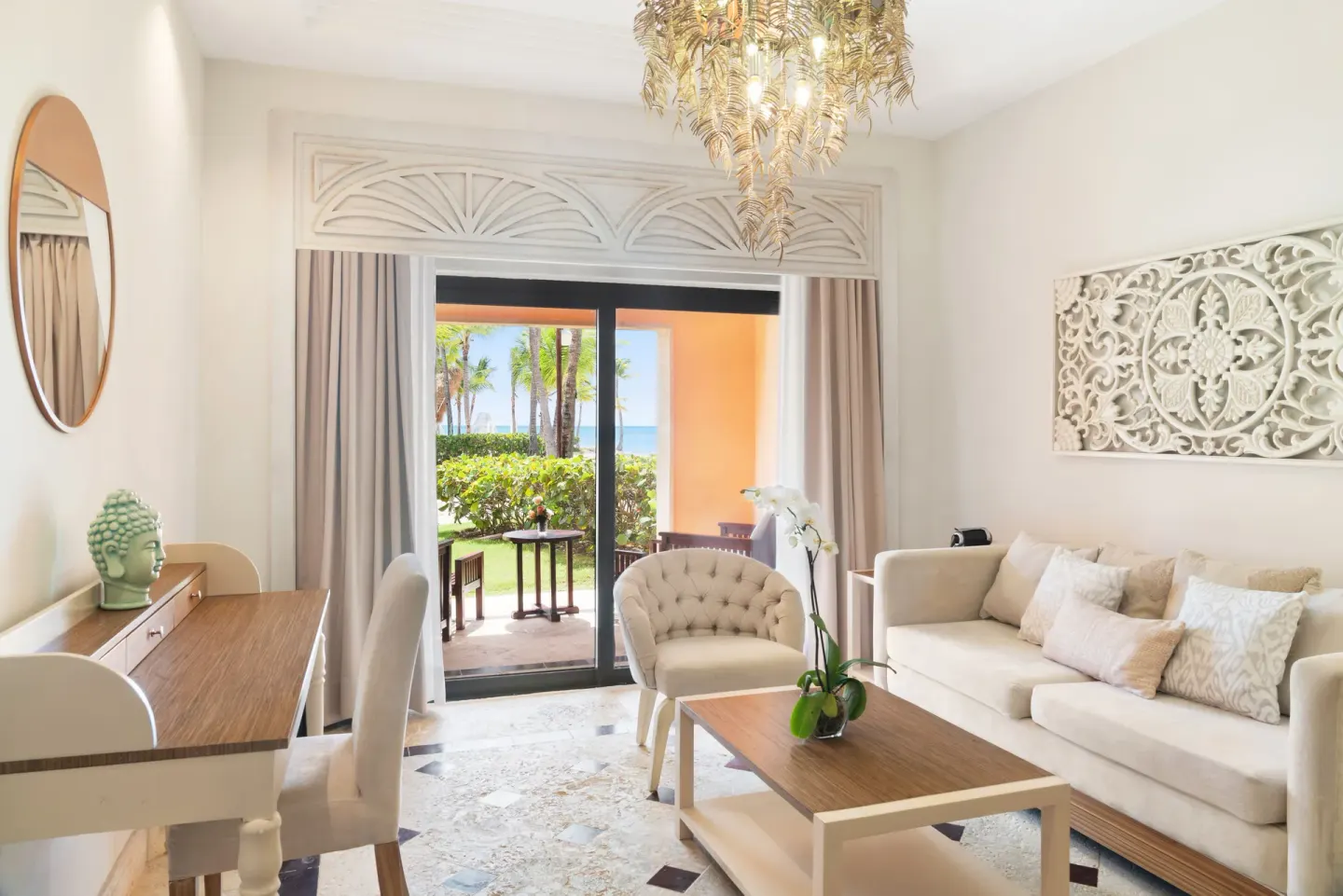 Bright sitting area with patio doors at Sanctuary Cap Cana, a Luxury Collection Resort.