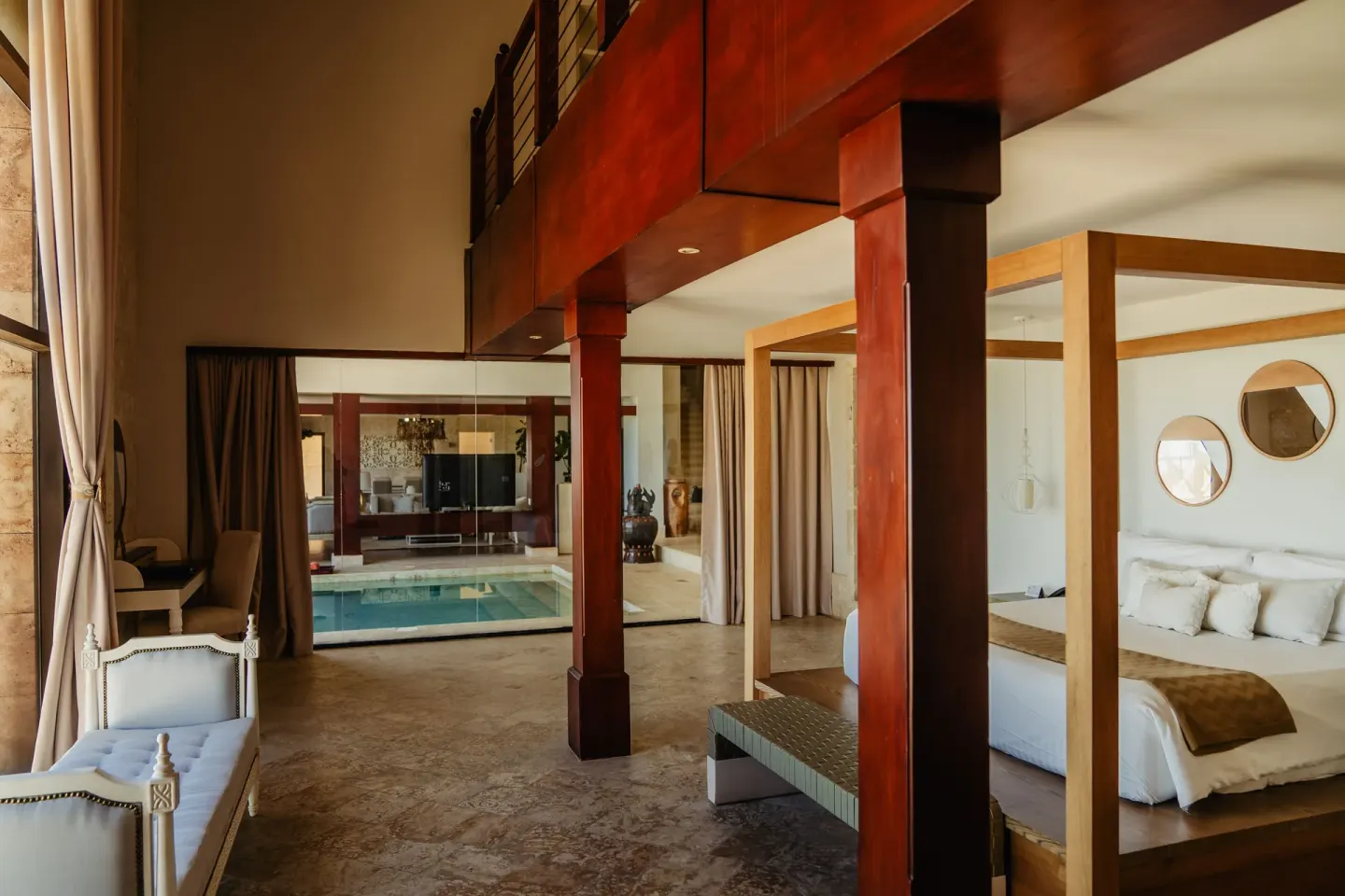 Loft-style villa bedroom with indoor pool at Sanctuary Cap Cana, a Luxury Collection Resort.