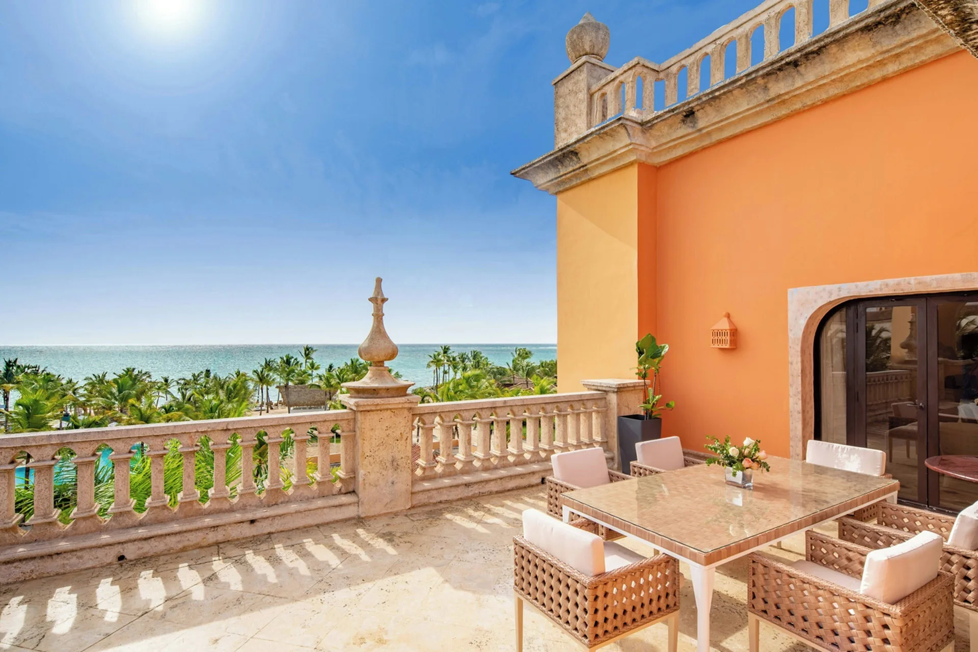 Ocean-view terrace with dining table at Sanctuary Cap Cana, a Luxury Collection Resort.