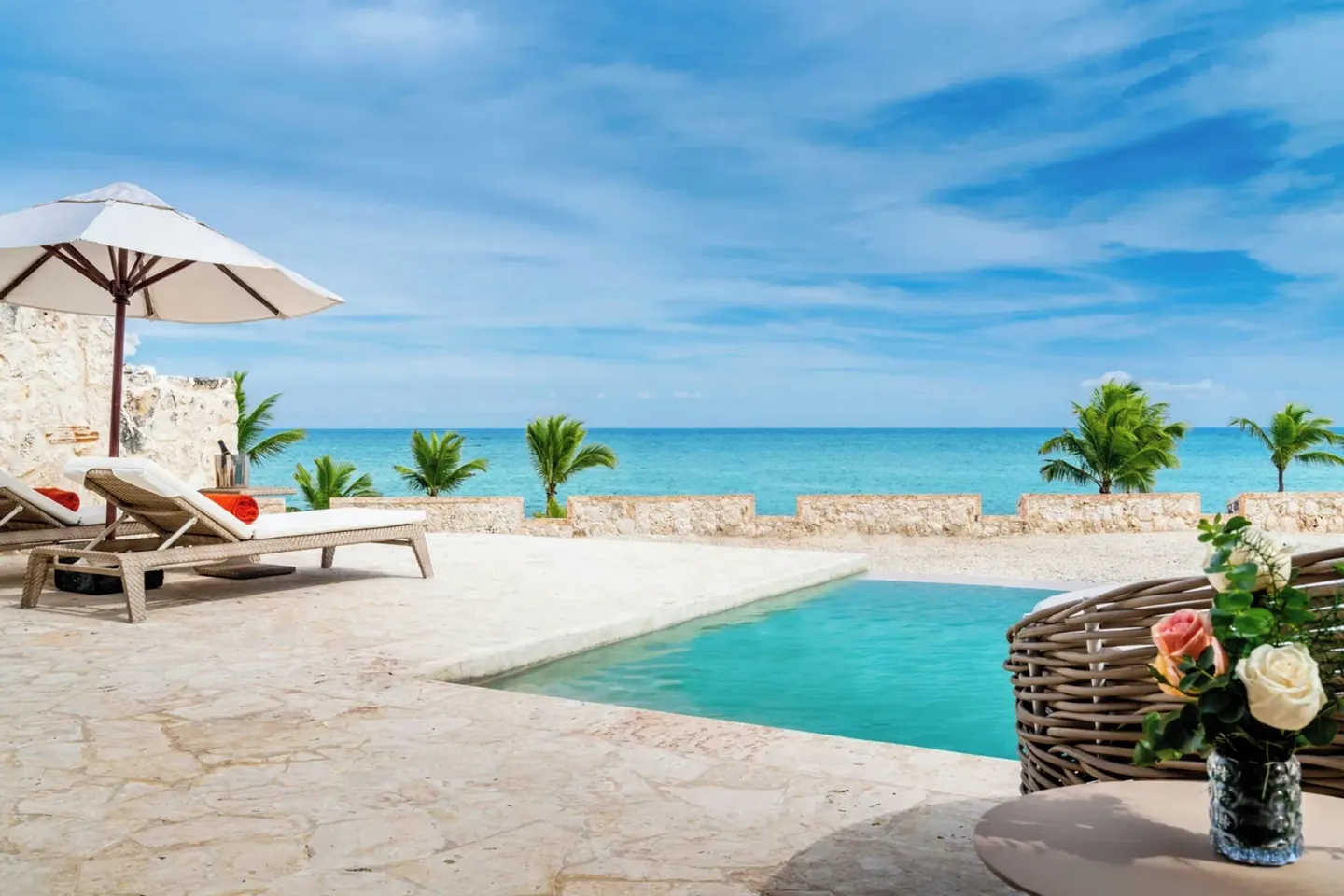 Private pool terrace with loungers and ocean view at Sanctuary Cap Cana, a Luxury Collection Resort.