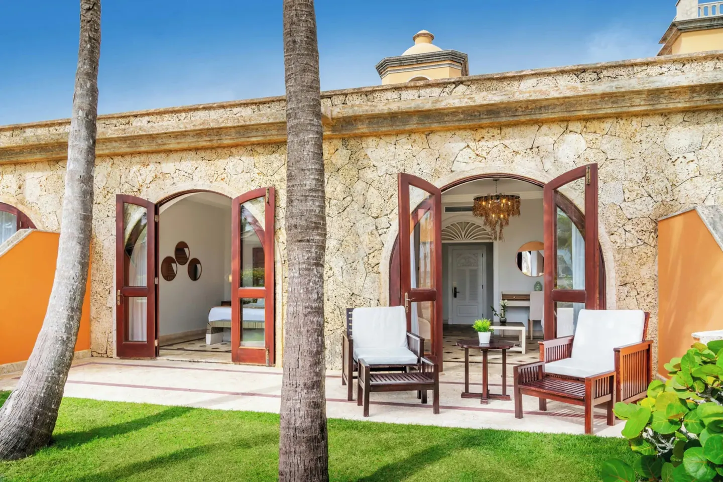Beachfront Junior Suite balcony and lawn at Sanctuary Cap Cana, a Luxury Collection Resort.