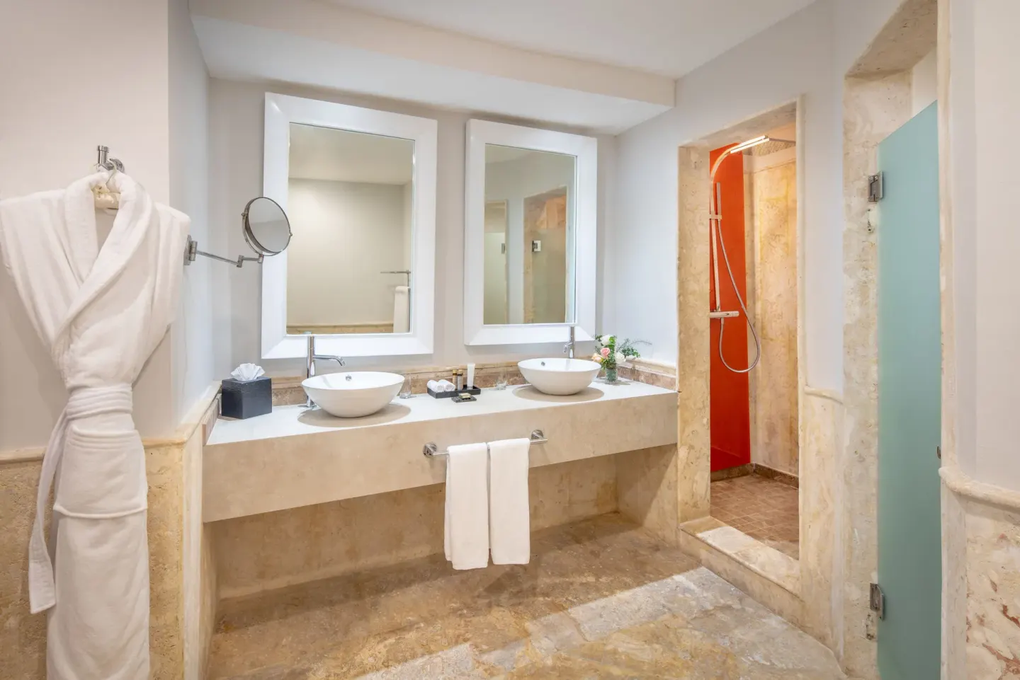 Junior Suite bathroom with double sinks and shower at Sanctuary Cap Cana, a Luxury Collection Resort.
