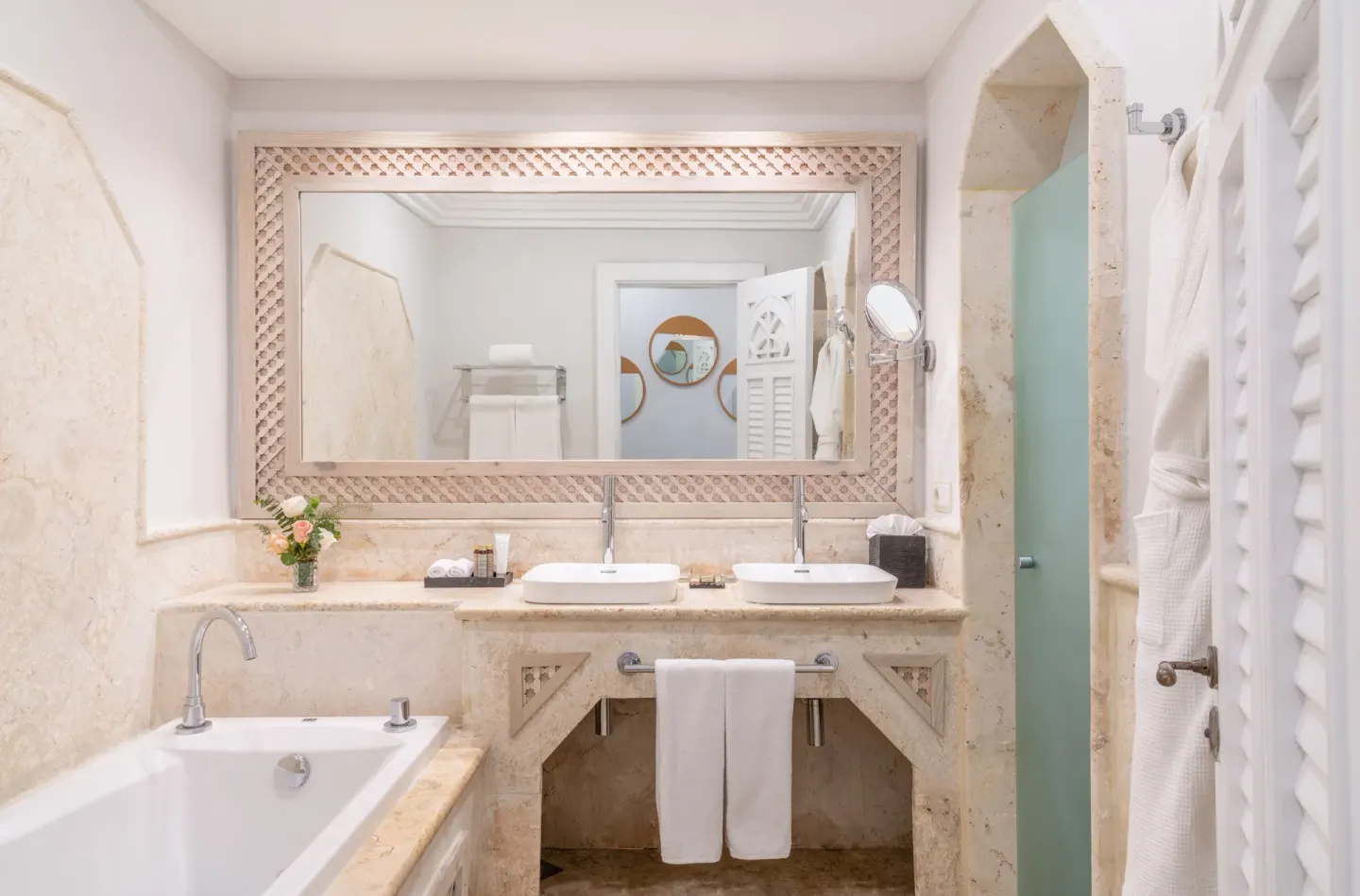 Junior Suite bathroom with tub and double vanity at Sanctuary Cap Cana, a Luxury Collection Resort.