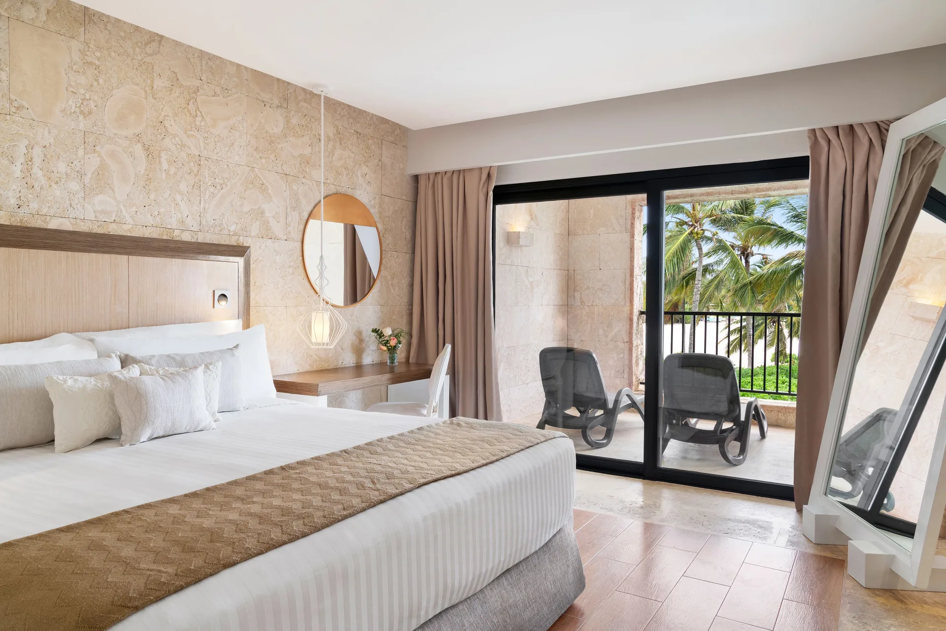 Junior Suite Balcony Ocean View Castle at Sanctuary Cap Cana with king bed, balcony access, and ocean views from the castle building.