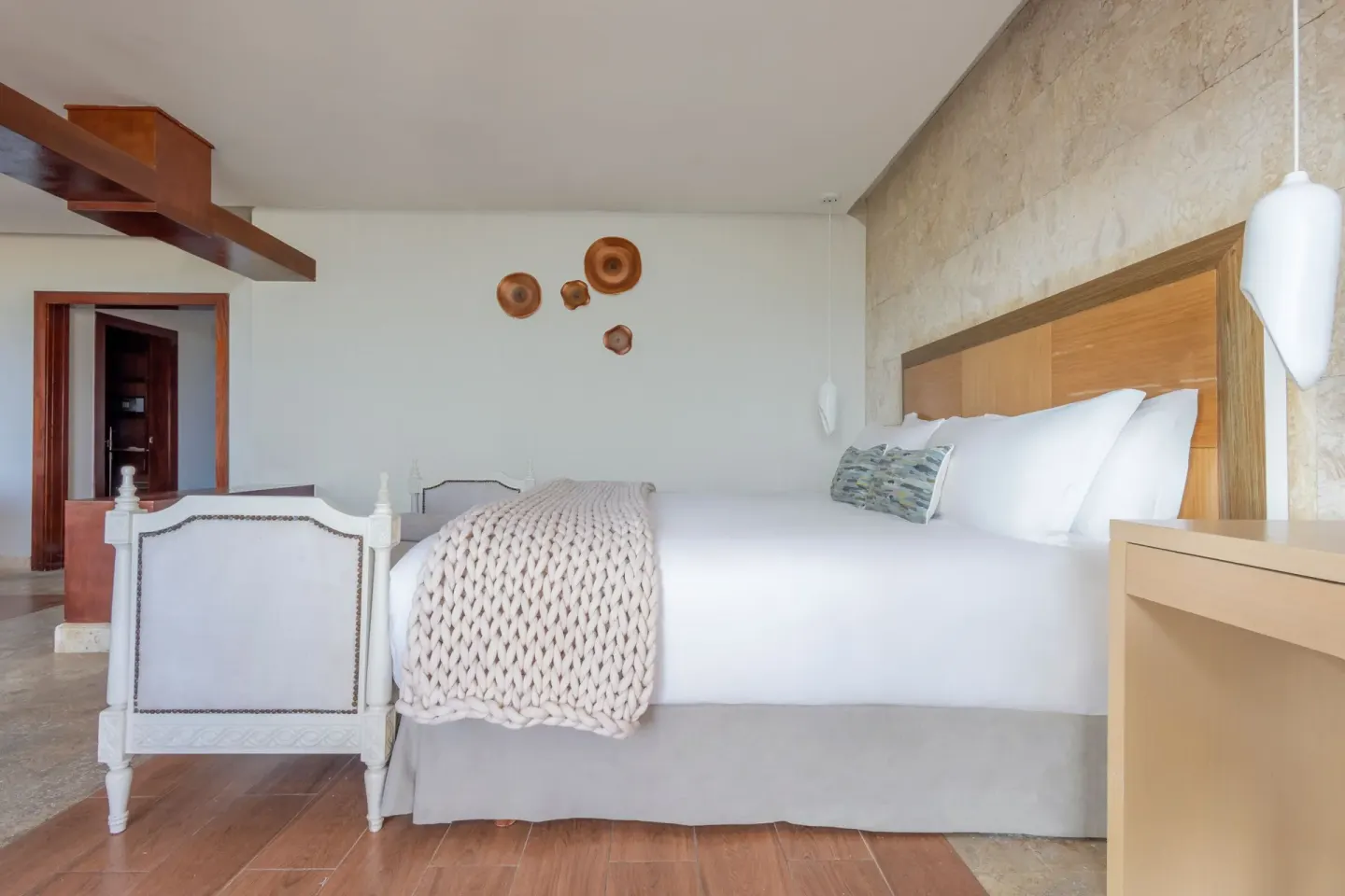 Junior Suite bedroom with king bed at Sanctuary Cap Cana, a Luxury Collection Resort.