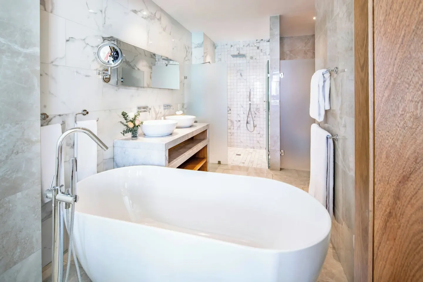 Junior Suite bathroom with soaking tub and walk-in shower at Sanctuary Cap Cana, a Luxury Collection Resort.