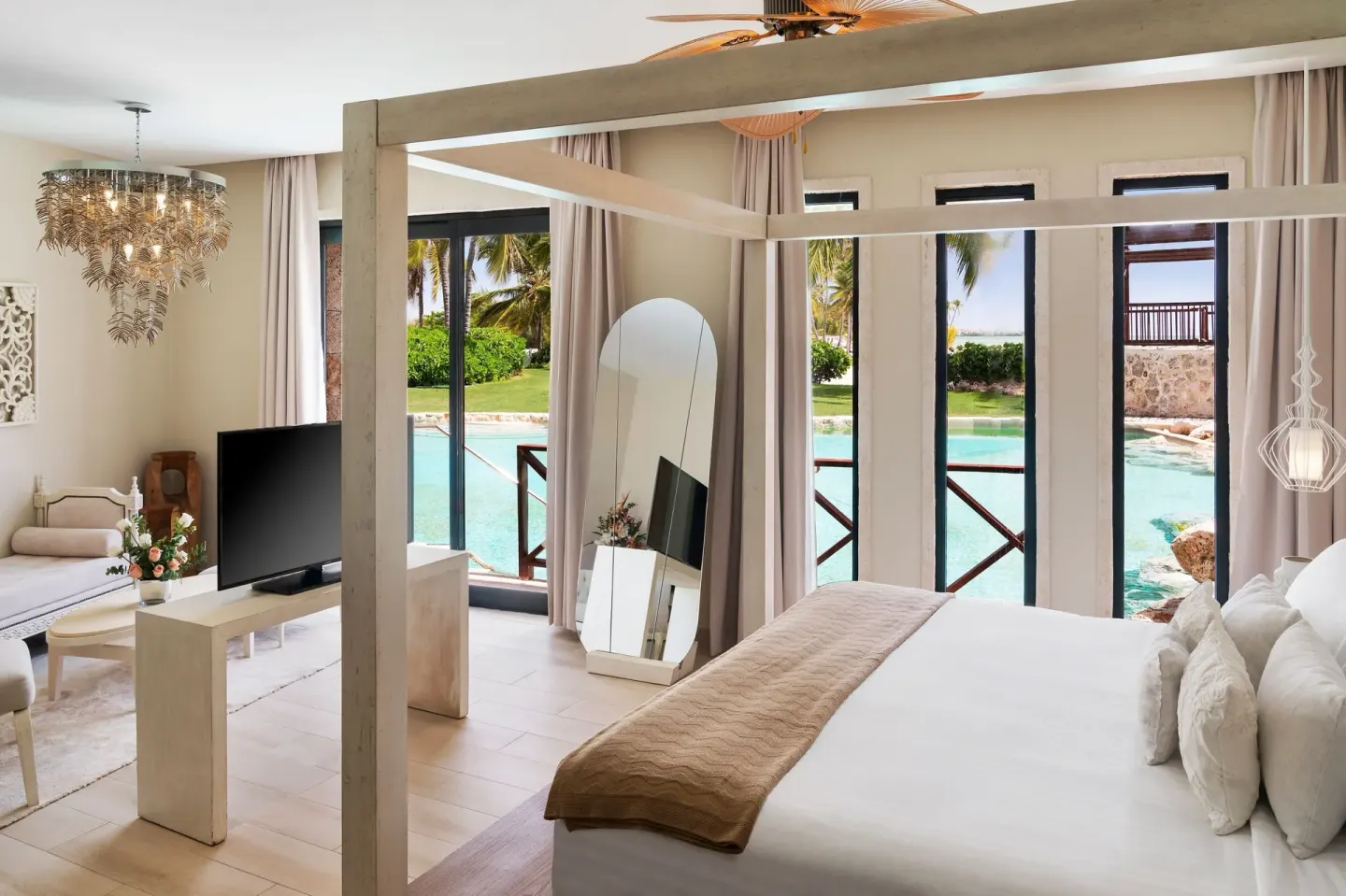 Junior Suite swim-out bedroom and pool view at Sanctuary Cap Cana, a Luxury Collection Resort.