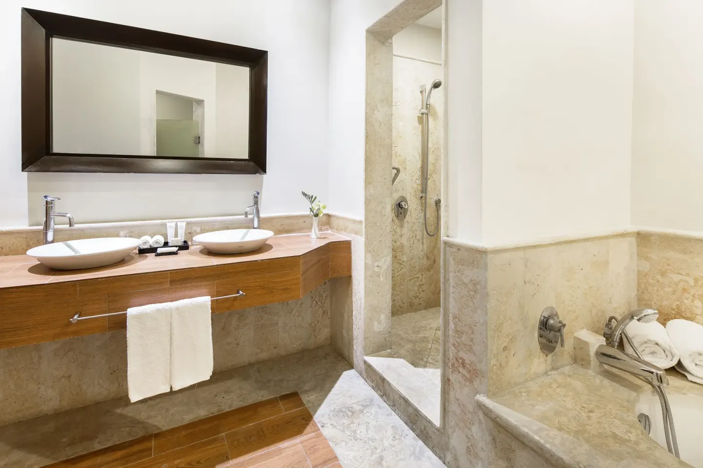 Suite bathroom with double sinks, shower and tub at Sanctuary Cap Cana, a Luxury Collection Resort.