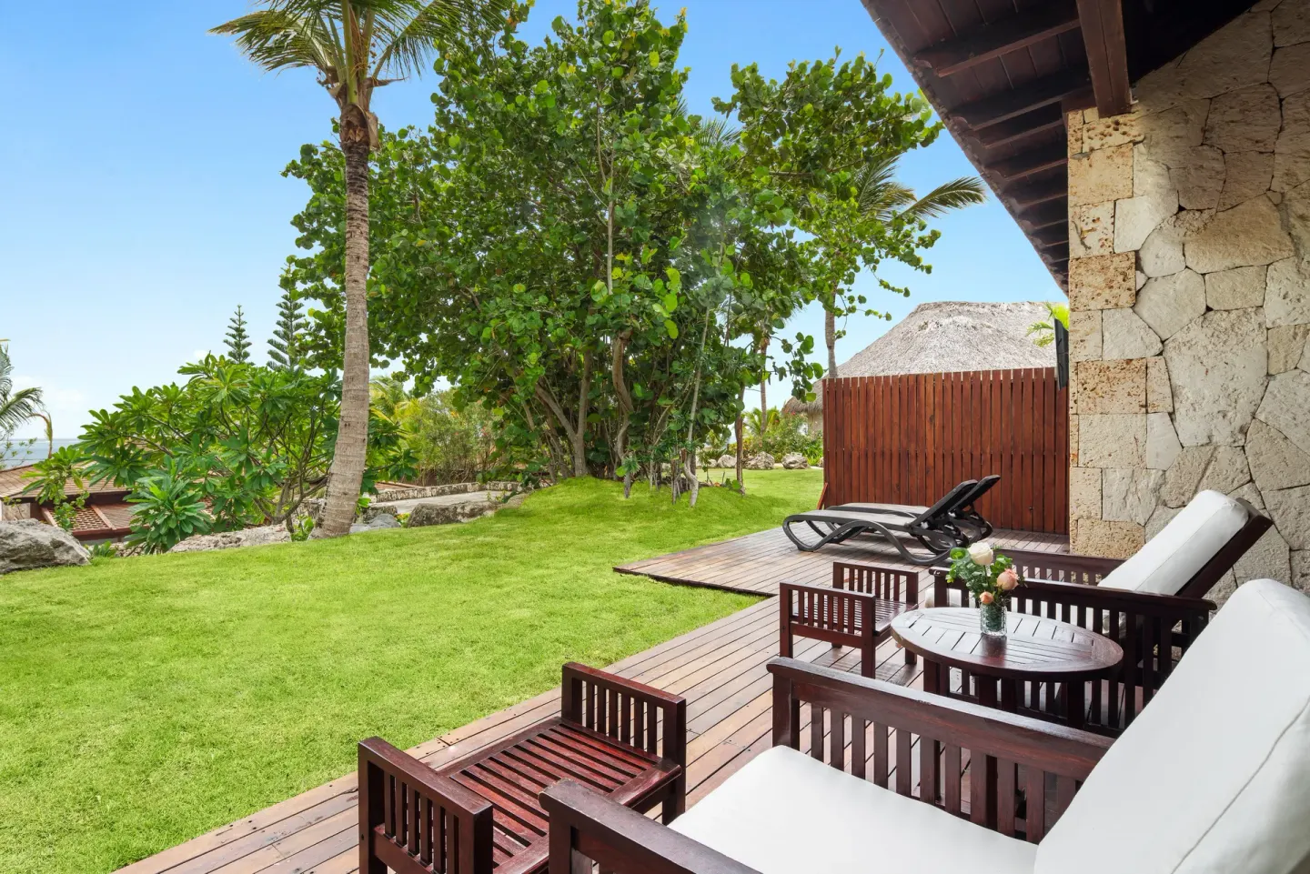 Villa garden view balcony with lounge seating at Sanctuary Cap Cana, a Luxury Collection Resort.