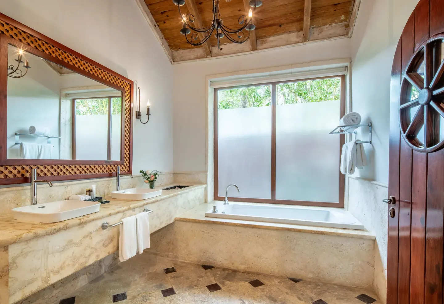 Villa garden view bathroom with soaking tub at Sanctuary Cap Cana, a Luxury Collection Resort.