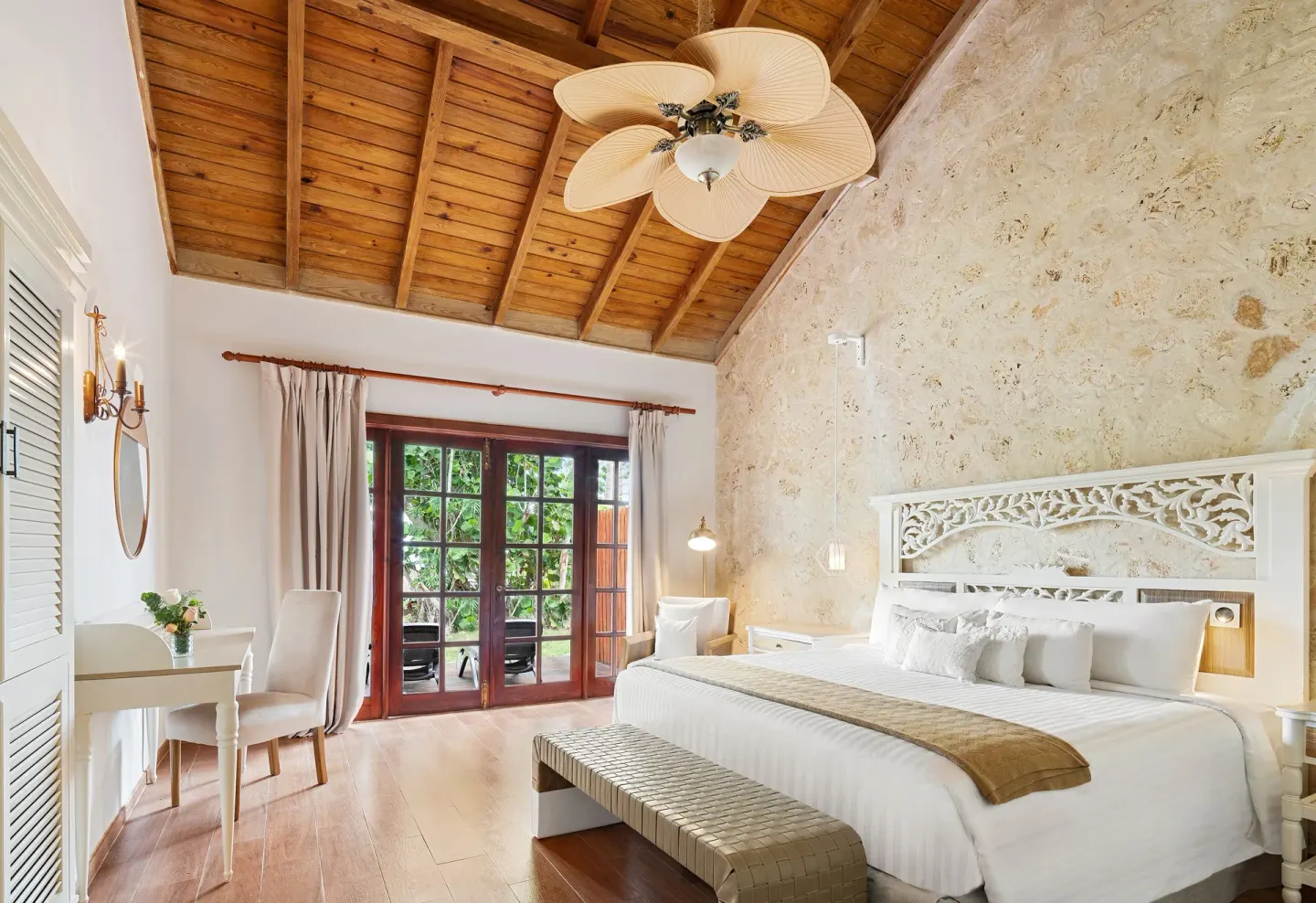 Villa garden view king bedroom with terrace doors at Sanctuary Cap Cana, a Luxury Collection Resort.