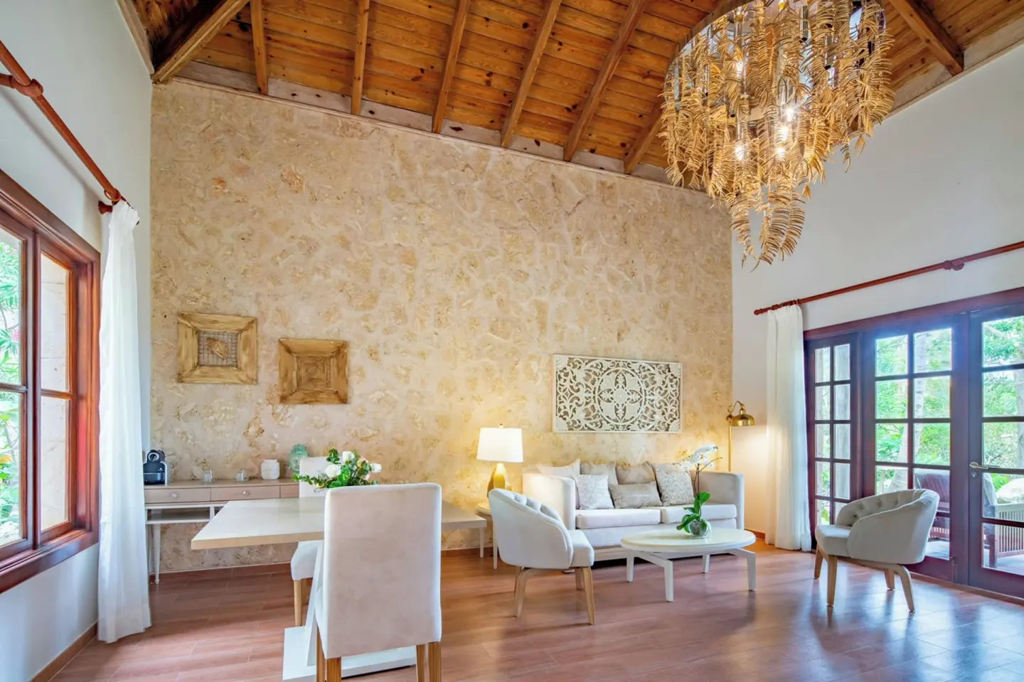 Oceanfront villa living room with vaulted wood ceiling at Sanctuary Cap Cana, a Luxury Collection Resort.