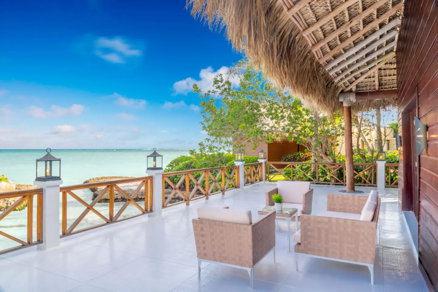 Oceanside villa terrace overlooking the water at Sanctuary Cap Cana, a Luxury Collection Resort.