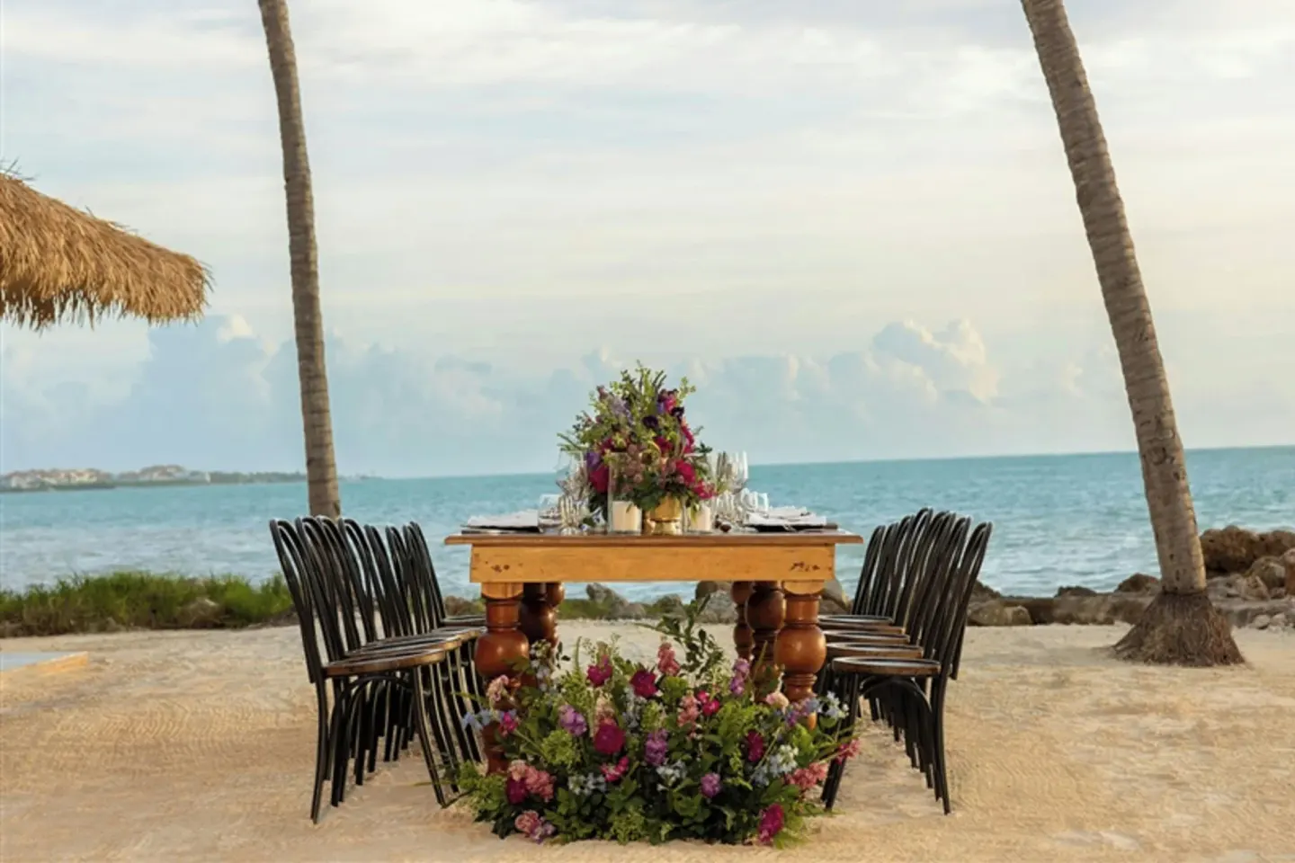 Oceanfront event table with flowers at Sanctuary Cap Cana, a Luxury Collection Resort