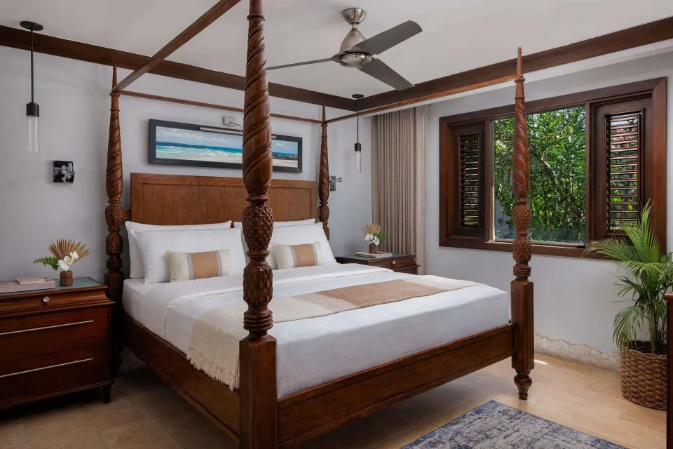 Four-poster king bed in a garden view luxury suite at Sandals Barbados.