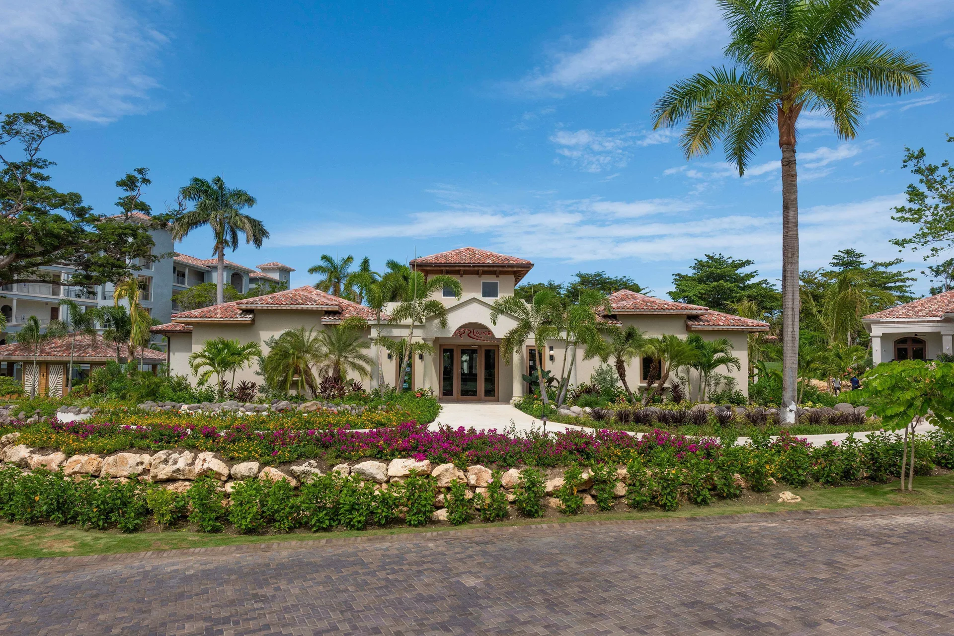 Landscaped villa-style building and palm trees at Sandals Dunns River.
