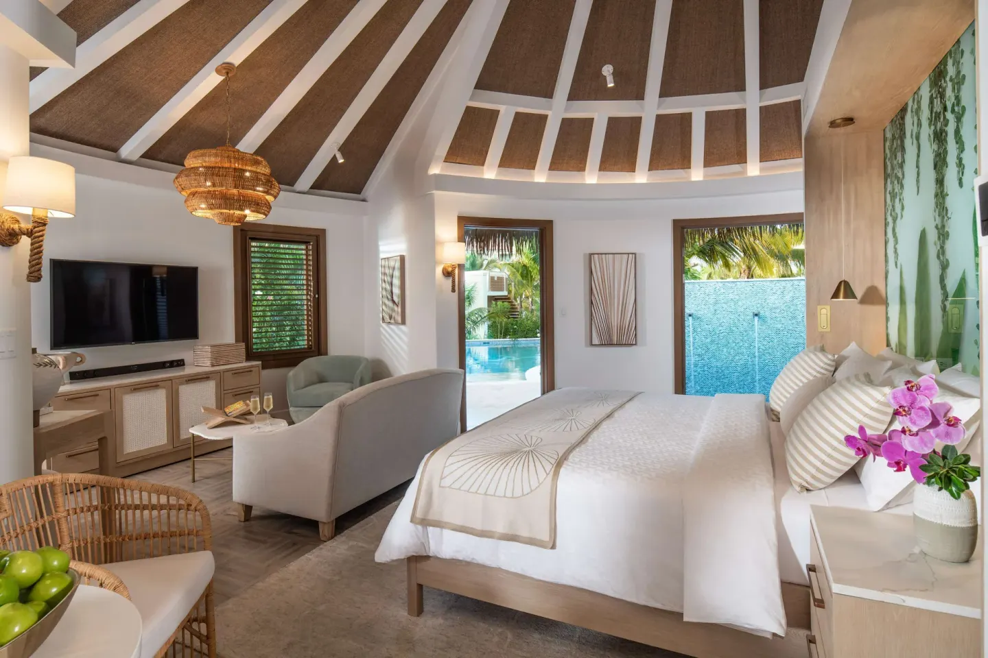Villa-style king-bed room with pool access at Sandals Dunns River.
