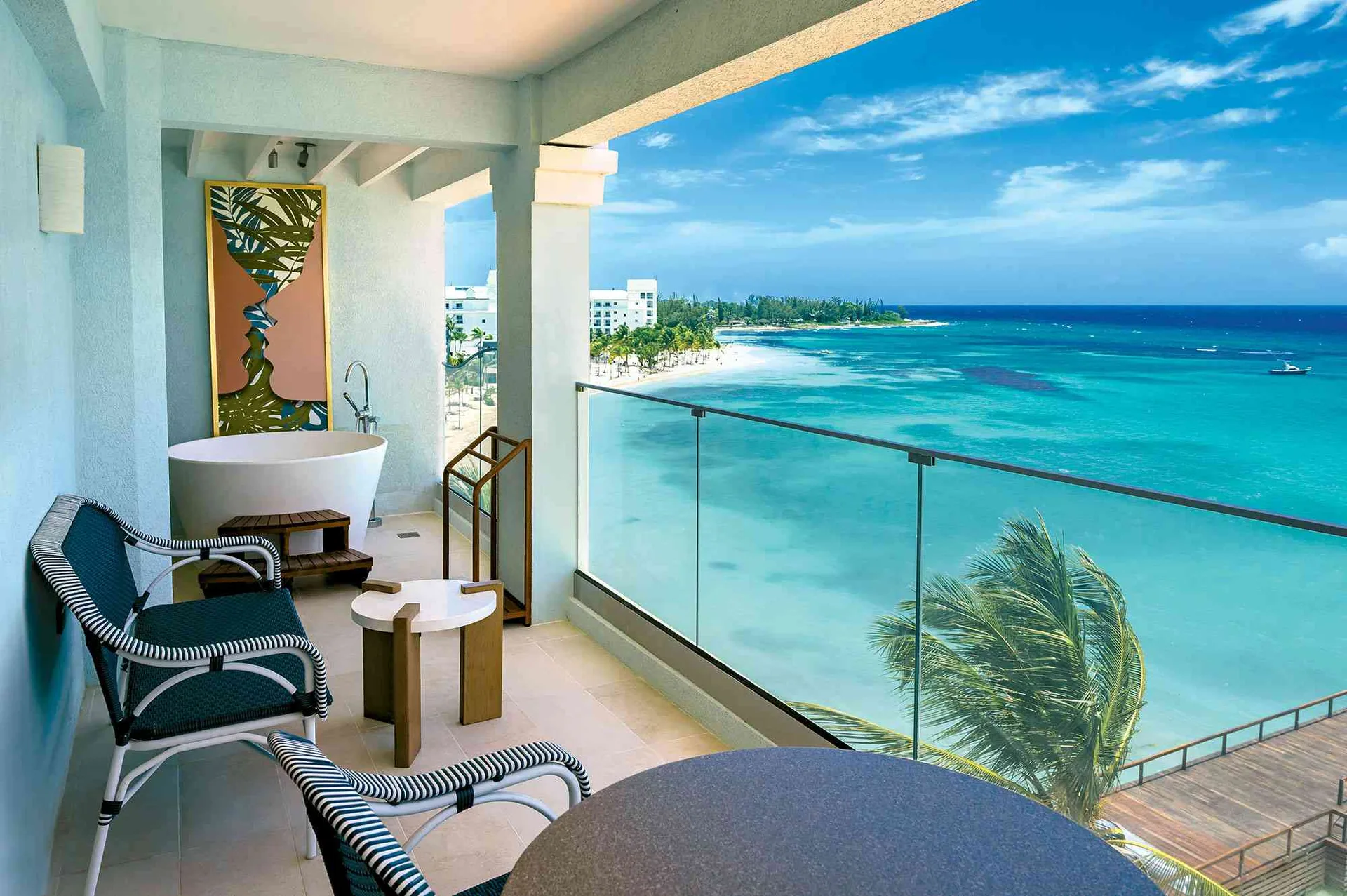 Mammee Bay Oversized Club Level Junior Suite at Sandals Dunns River with balcony and Tranquility Soaking Tub overlooking Jamaica.