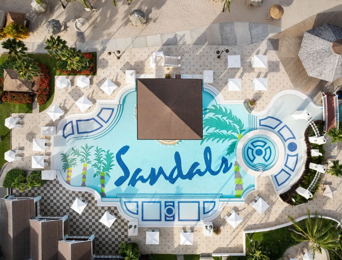 Aerial view of the main pool and deck at Sandals Grande St. Lucian.