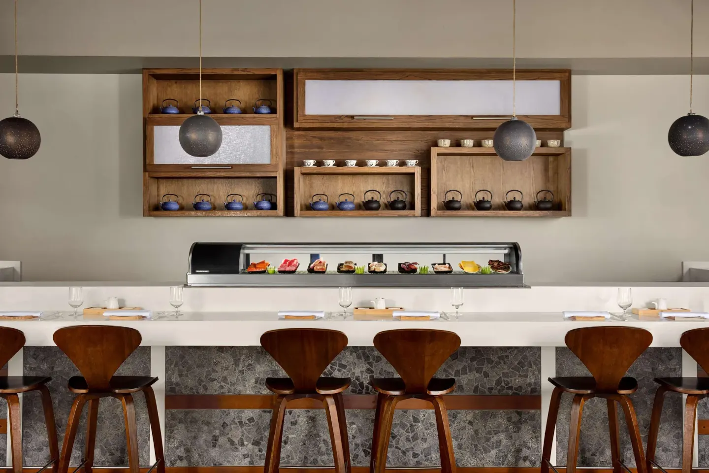 Sushi bar with display case and teapots at Soy at Sandals Grande St. Lucian.