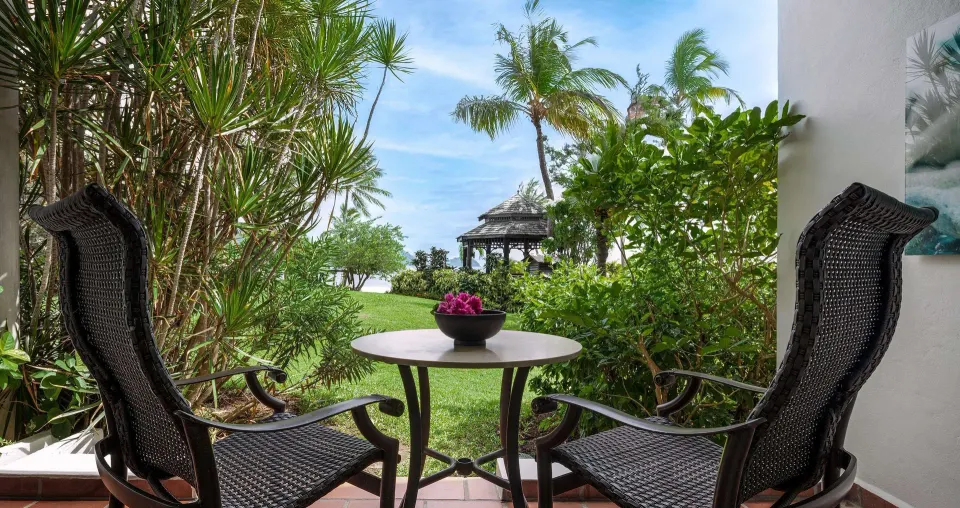 Garden patio seating outside a Club Room at Sandals Grande St. Lucian.