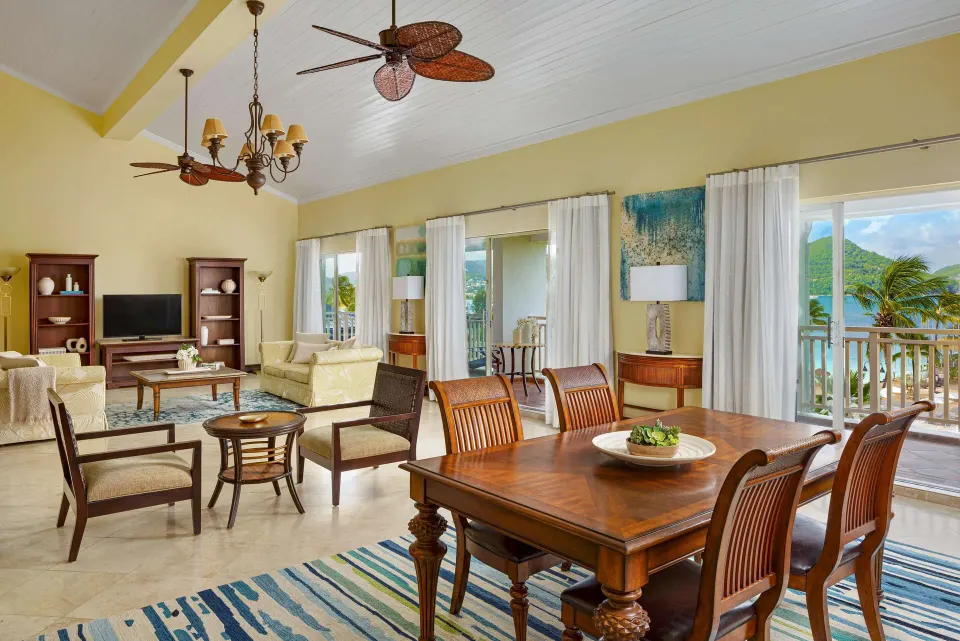 Luxury one-bedroom suite living and dining area at Sandals Grande St. Lucian.