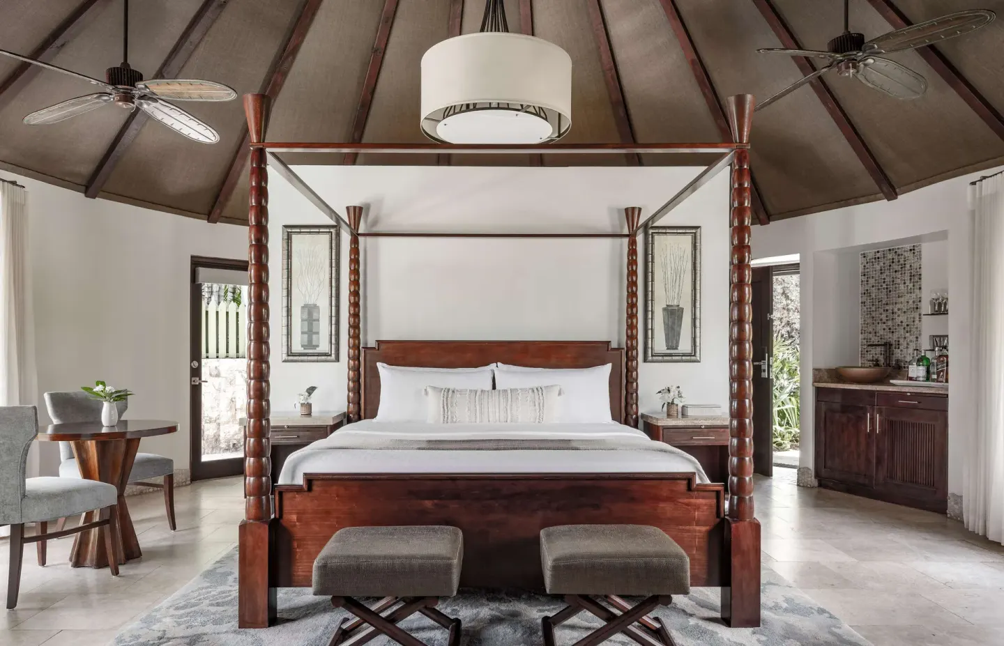 Luxury rondoval suite bedroom with four-poster bed at Sandals Grande St. Lucian.