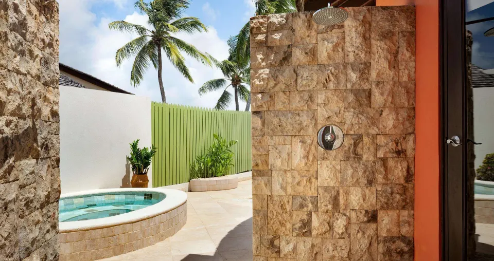 Outdoor shower and plunge pool courtyard of a luxury suite at Sandals Grande St. Lucian.