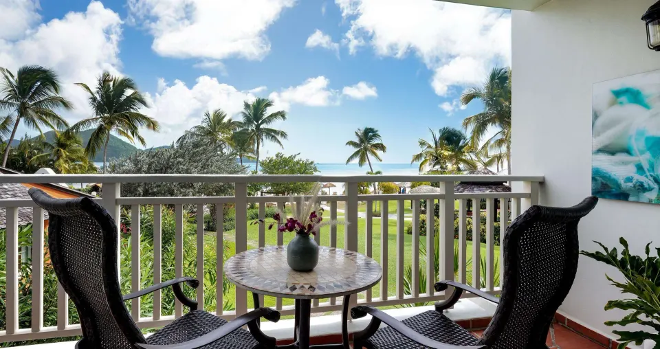 Premium room balcony with partial ocean view at Sandals Grande St. Lucian.