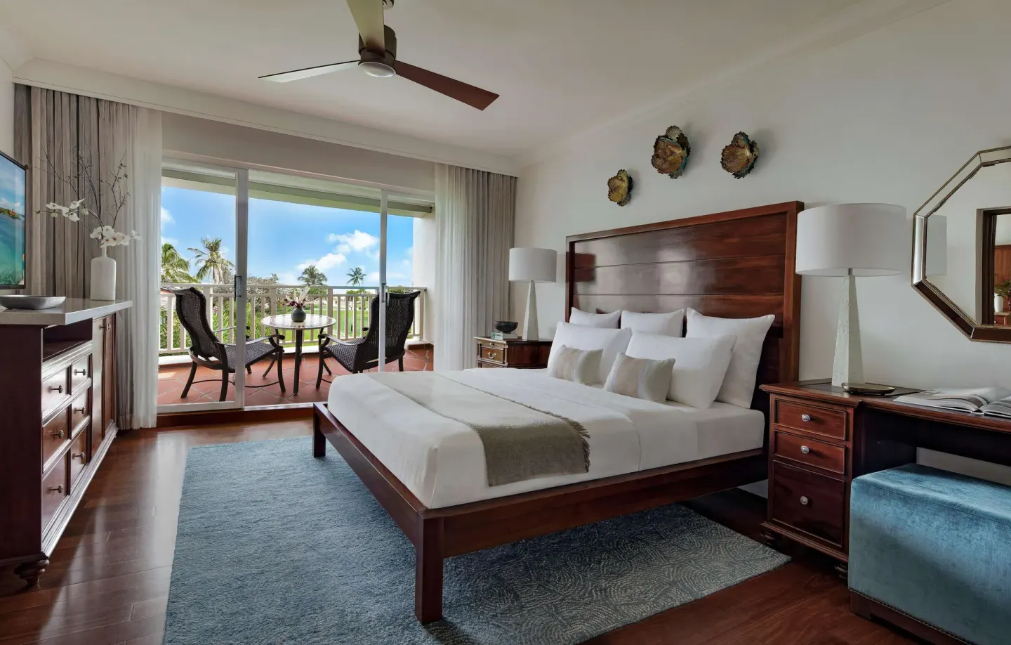 Premium king bedroom with balcony seating at Sandals Grande St. Lucian.