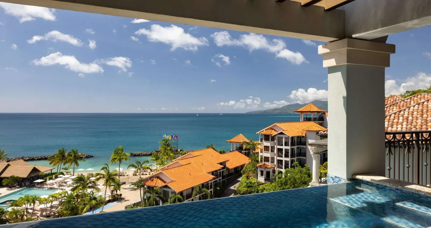 Infinity plunge pool balcony with ocean and resort views at Sandals Grenada.