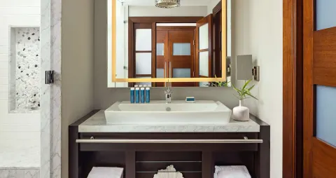 South Seas junior suite bathroom vanity and shower at Sandals Grenada.