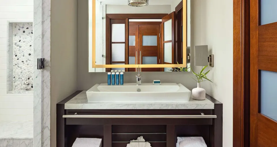 South Seas junior suite bathroom vanity and shower at Sandals Grenada.