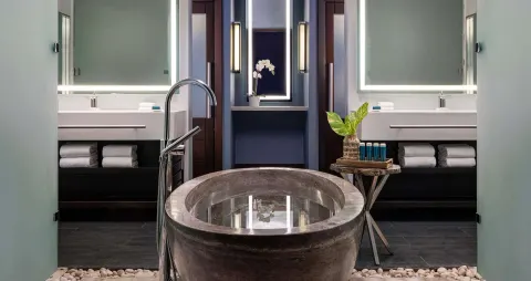Bathroom with soaking tub and dual vanities in a Luxury Suite at Sandals Grenada.