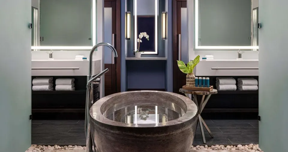 Bathroom with soaking tub and dual vanities in a Luxury Suite at Sandals Grenada.
