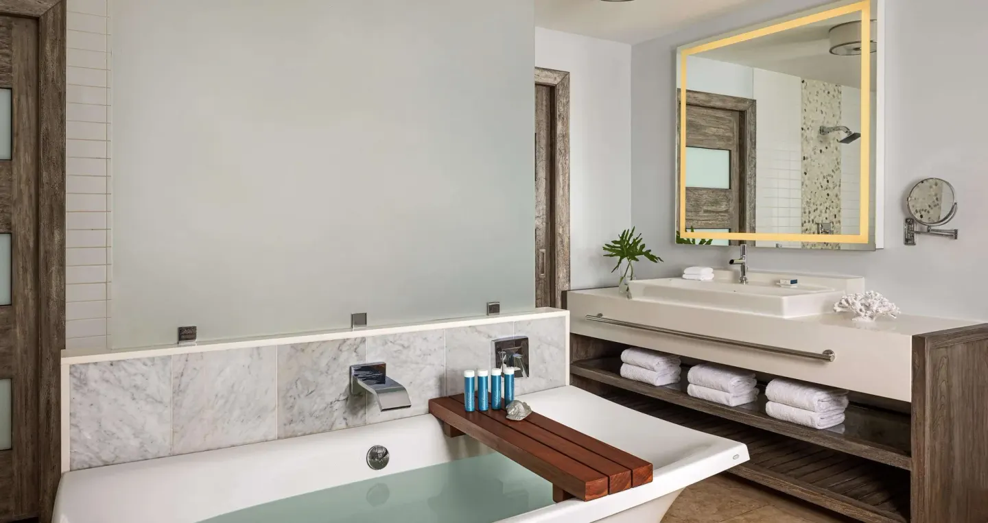 Romantic Suite bathroom with soaking tub and vanity at Sandals Grenada.