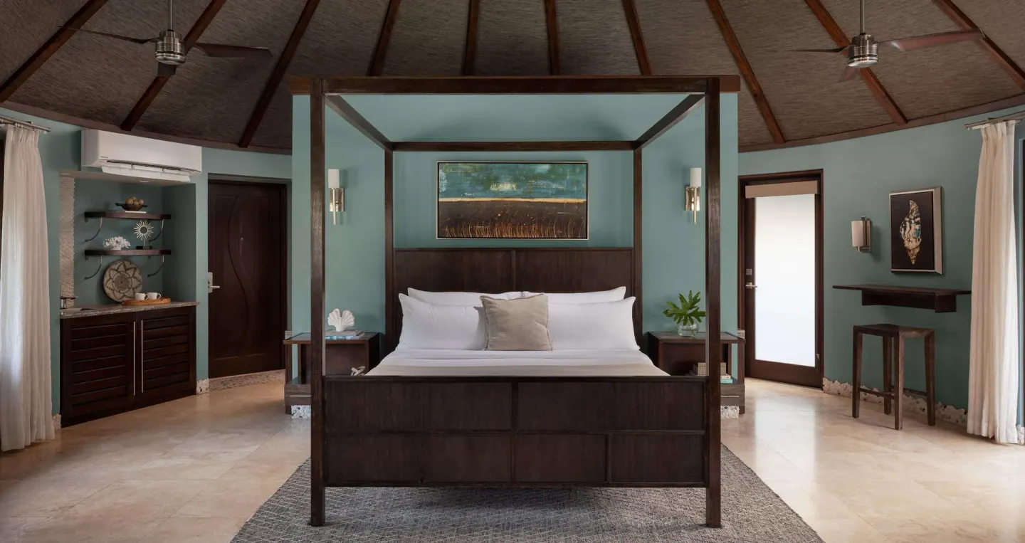 Four-poster king bed in a garden view suite at Sandals Grenada.