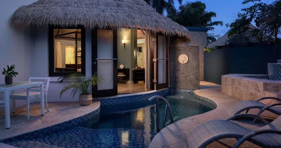 Private plunge pool outside a rondoval suite at dusk at Sandals Grenada.