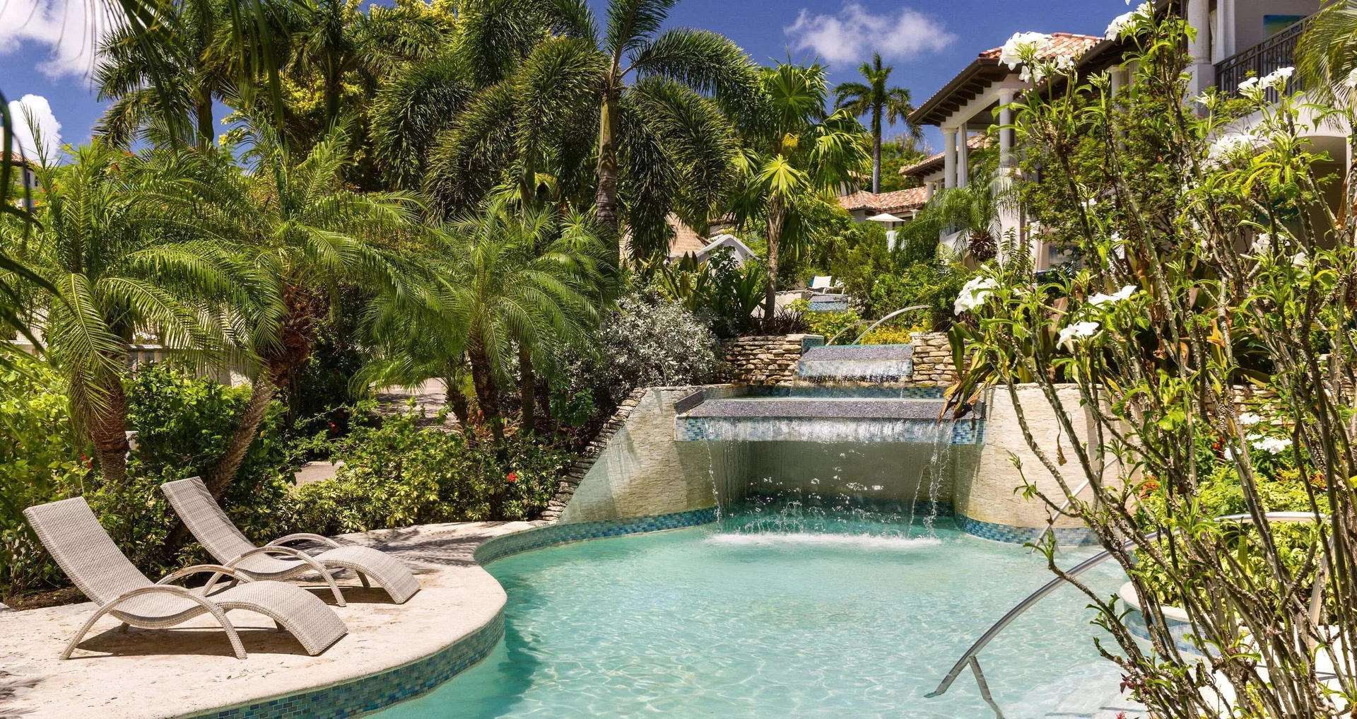 South Seas Walkout Junior Suite pool terrace and gardens at Sandals Grenada.