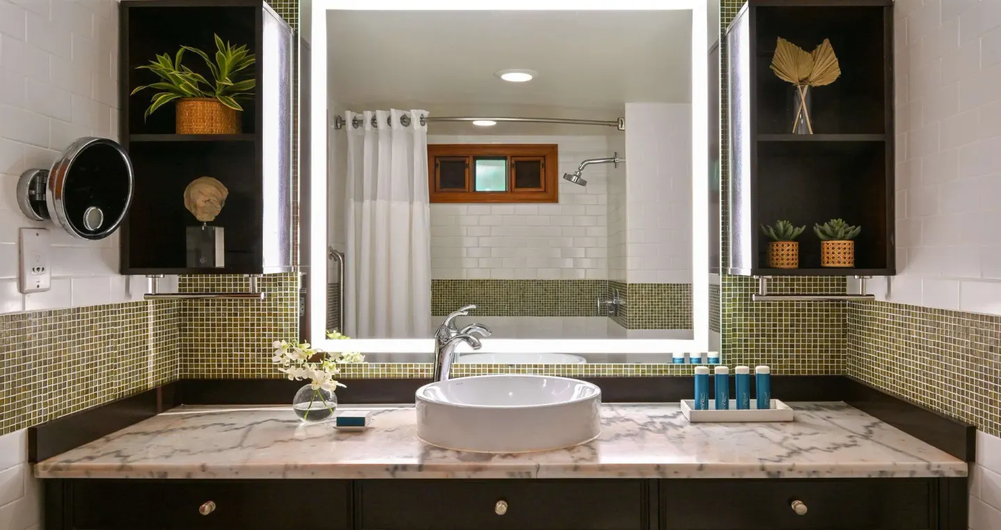 Club Room bathroom vanity with vessel sink and shower mirror view at Sandals Halcyon.