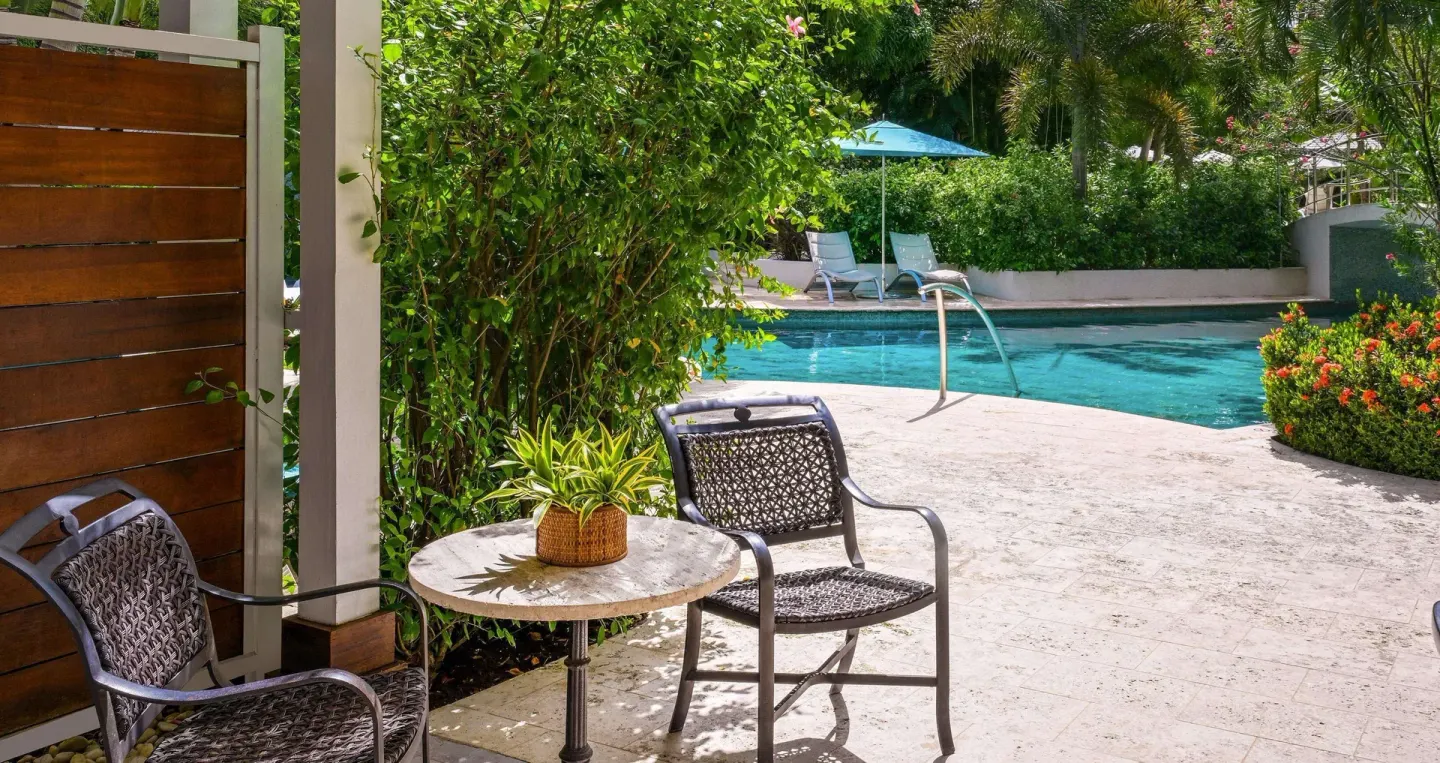 Club Room patio seating beside the swim-up pool at Sandals Halcyon.