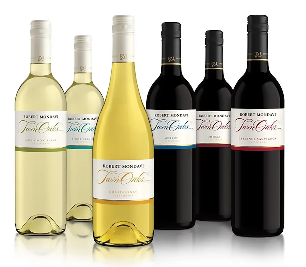 Assorted wine bottles photographed against a white background for Sandals Halcyon.