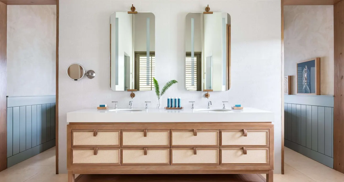Double vanity bathroom in a Shore House Butler Suite at Sandals Halcyon.