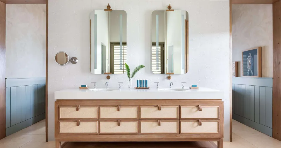 Double vanity bathroom in a Shore House Butler Suite at Sandals Halcyon.
