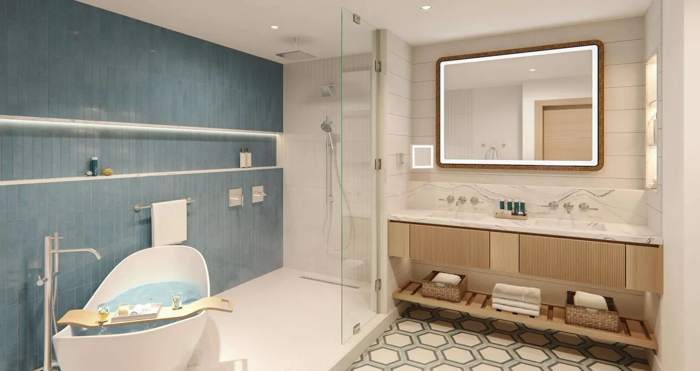 Modern bathroom with freestanding tub and glass shower at Sandals Montego Bay.