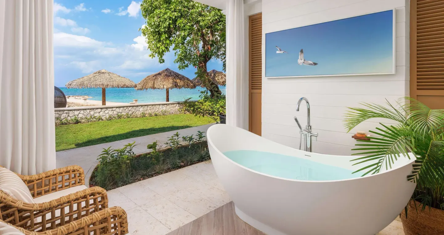 Private patio soaking tub overlooking the beach at Sandals Montego Bay.